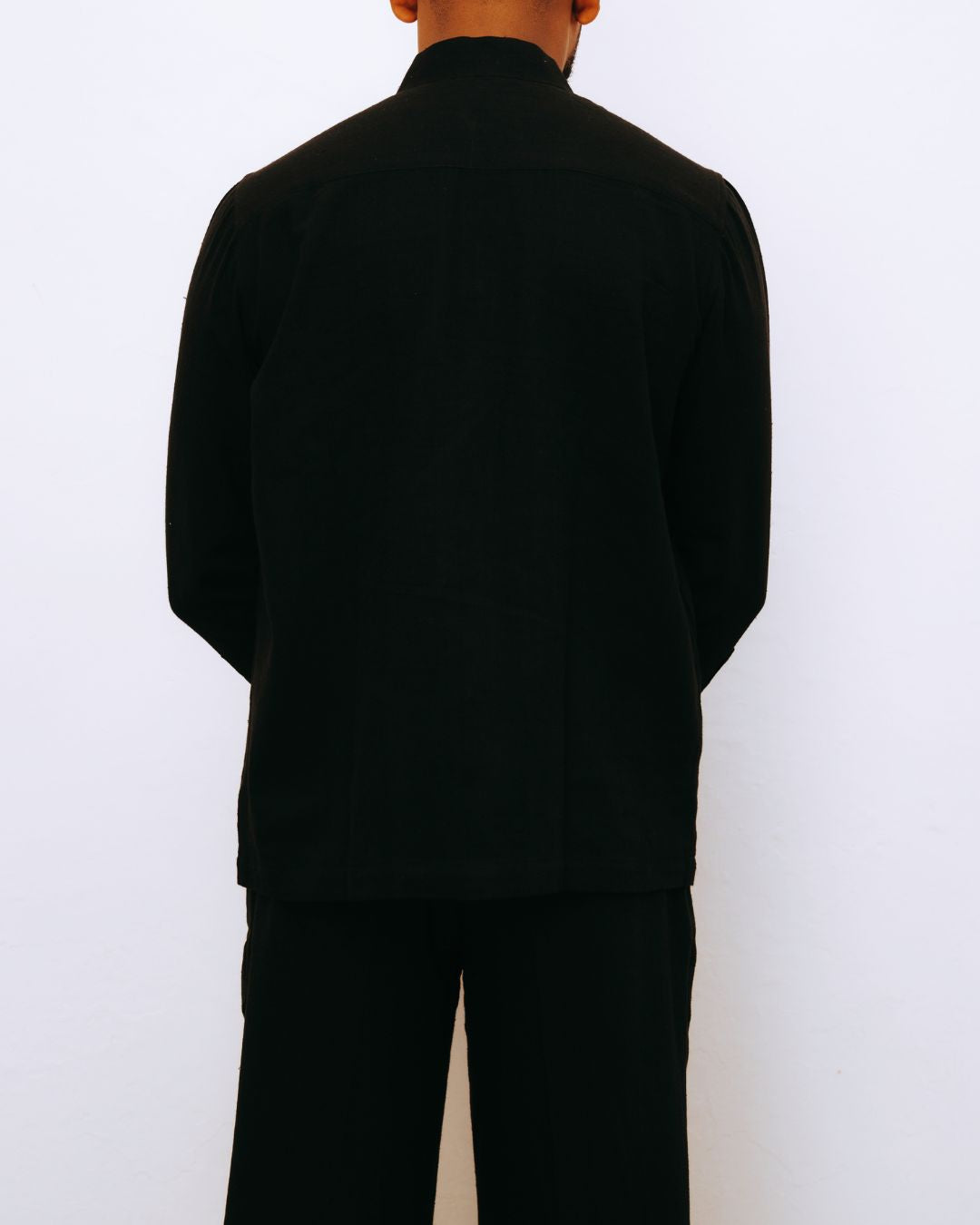 Person wearing a black outfit against a white background Sarmad Clothing collection by sukhanvar Mens Darwesh Co ord Set Shirt and wide leg pants Trouser Kala Cotton from kutch Bhujodi
