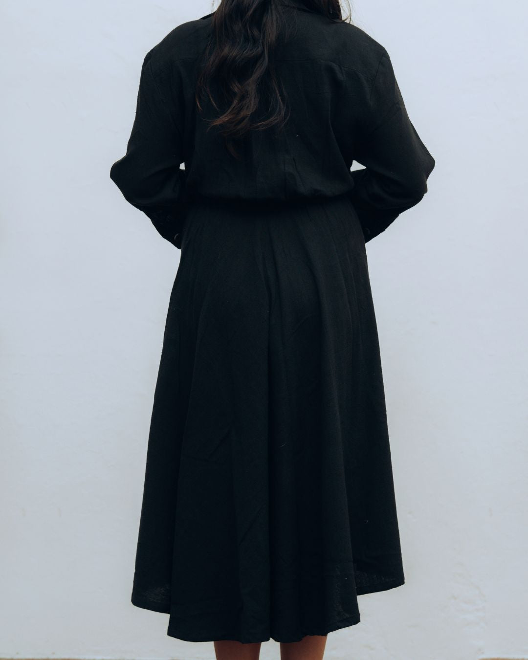 Person wearing a black dress against a white background Sarmad Clothing collection by sukhanvar Raqs Flowing Dress in KalaCotton from kutch Bhujodi