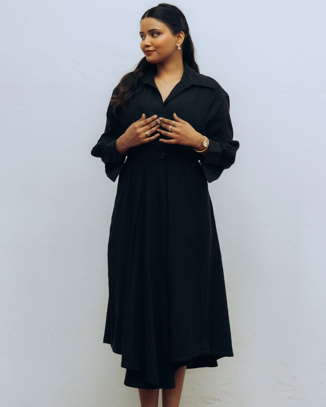 Woman wearing a black dress against a white background Sarmad Clothing collection by sukhanvar Raqs Flowing Dress in KalaCotton from kutch Bhujodi