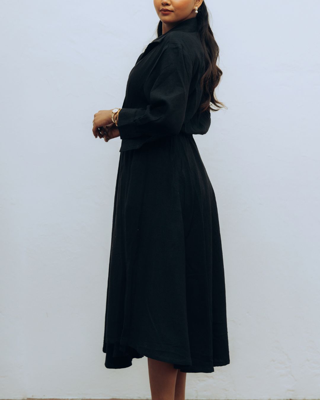 Woman wearing a black dress against a white background Sarmad Clothing collection by sukhanvar Raqs Flowing Dress in KalaCotton from kutch Bhujodi