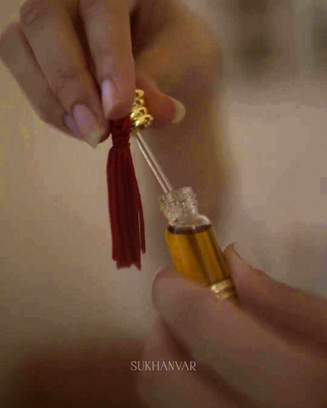 Handcrafted Hijr Attar by Sukhanvar featuring a glass dip stick applicator for precise application of concentrated fragrance oil.