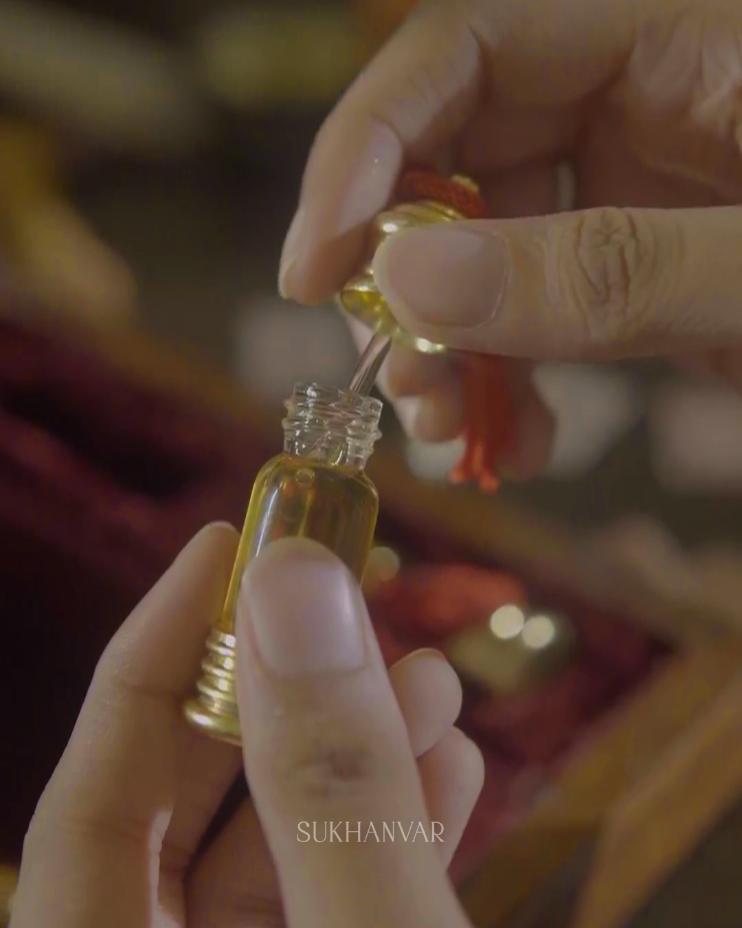 Handcrafted Hijr Attar by Sukhanvar featuring a glass dip stick applicator for precise application of concentrated fragrance oil.