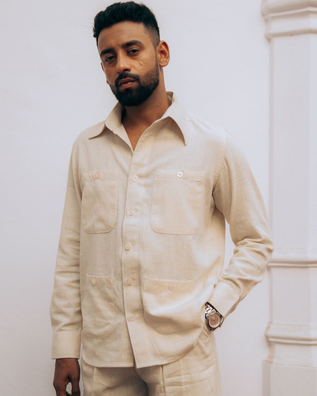 Man wearing a beige shirt against a white background Sarmad Clothing collection by sukhanvar Mens Raavi Co ord Set 4 Pocket Shirt and Trouser Kala Cotton from kutch Bhujodi